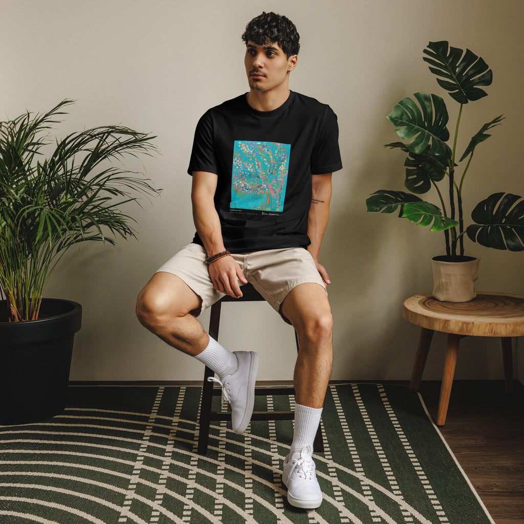 THE WISHING TREE I unisex eco t-shirt in Black – front on model, seated