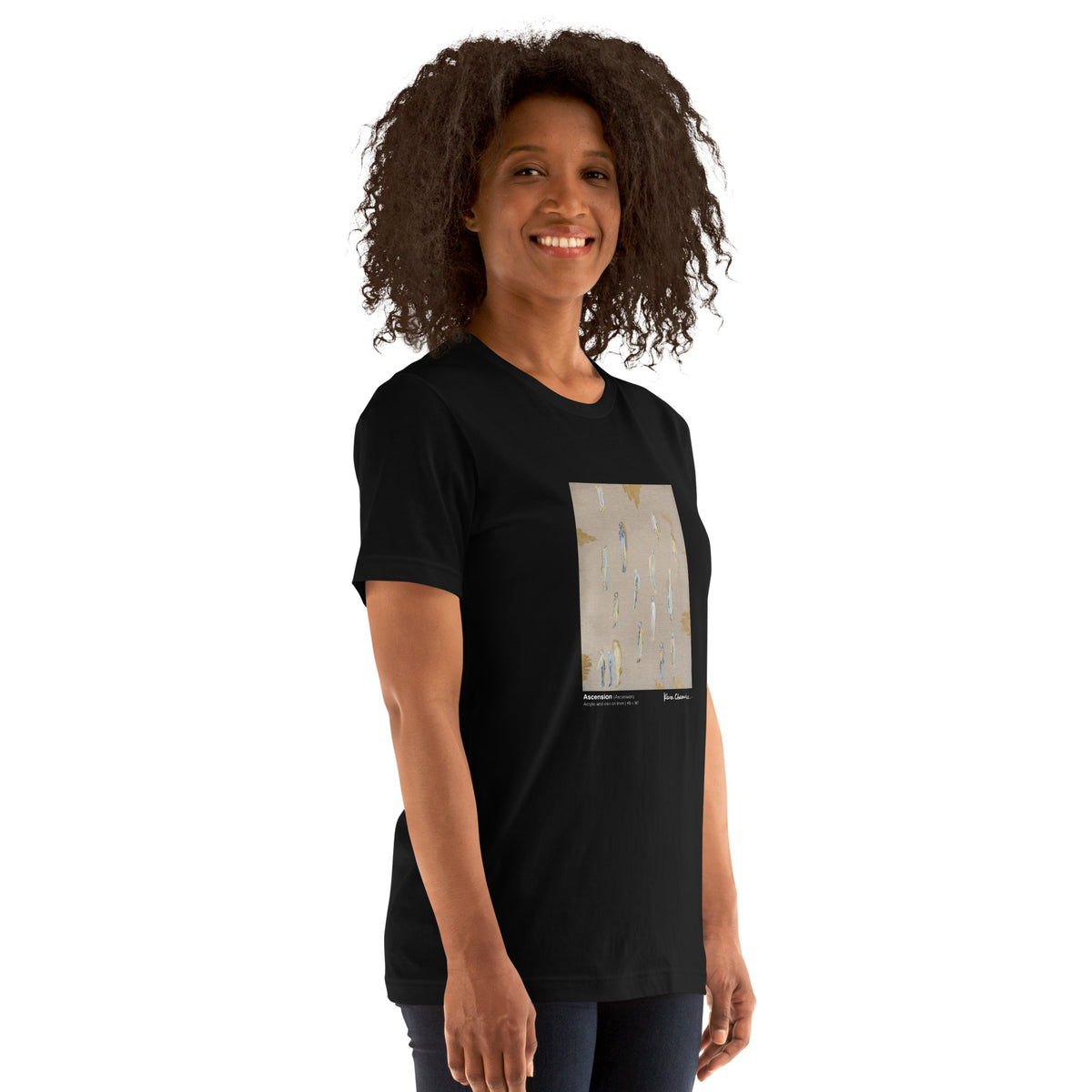 Smiling model with curly hair in the black tee, print on the chest, side view