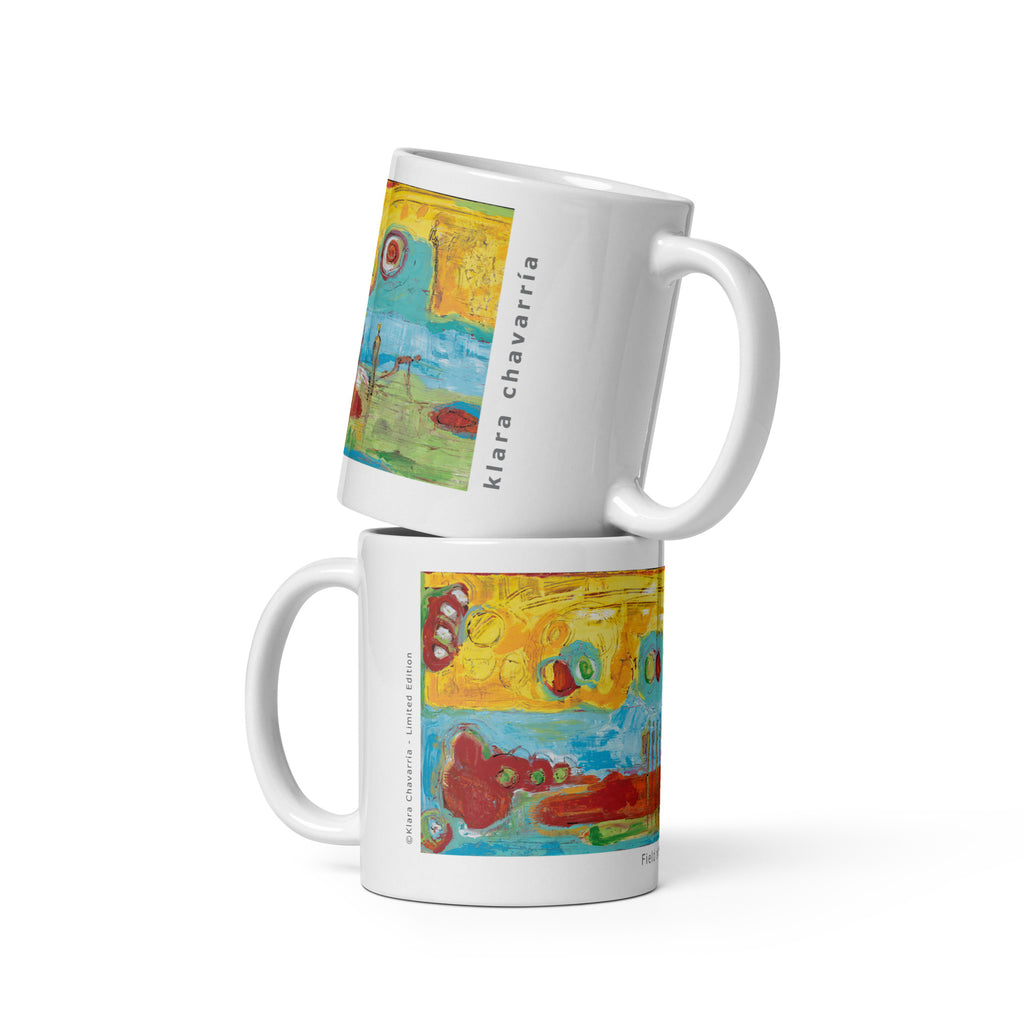 Two stacked white glossy mugs with a bright yellow, turquoise and red painting, FIELD OF DREAMS by Klara Chavarría