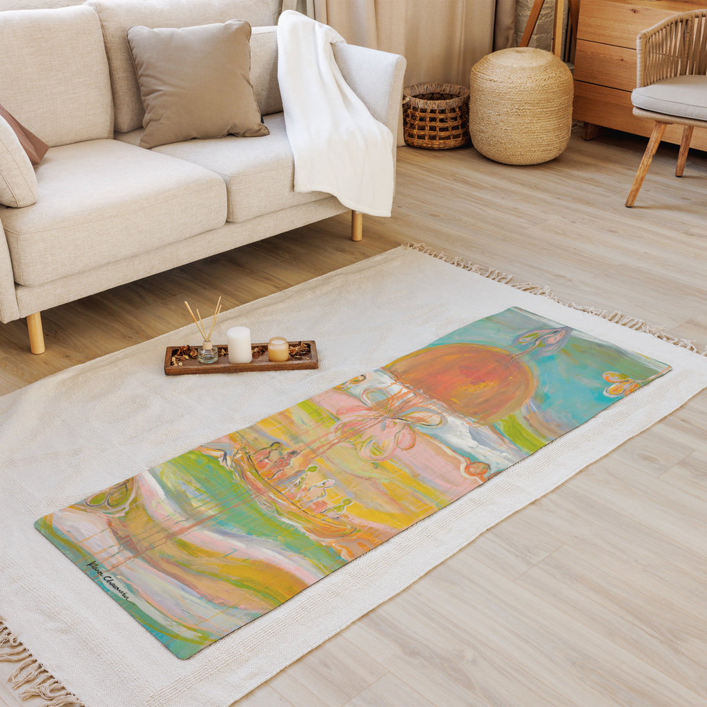 Mat laid on a fringed rug in a living room, in front of a beige sofa and a tray of candles