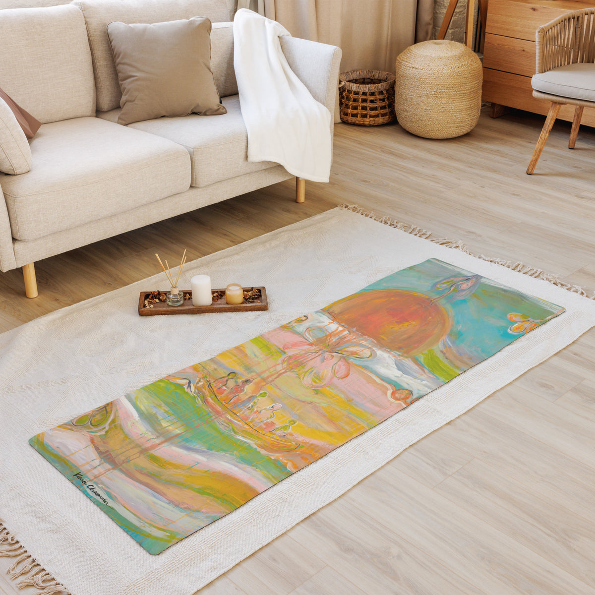 Mat laid on a fringed rug in a living room, in front of a beige sofa and a tray of candles